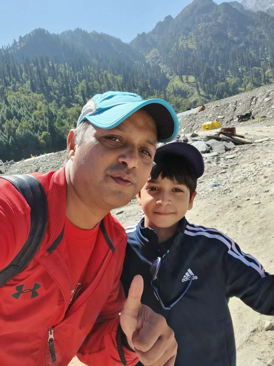 Dr Shashidhar with his son on a mountain trek