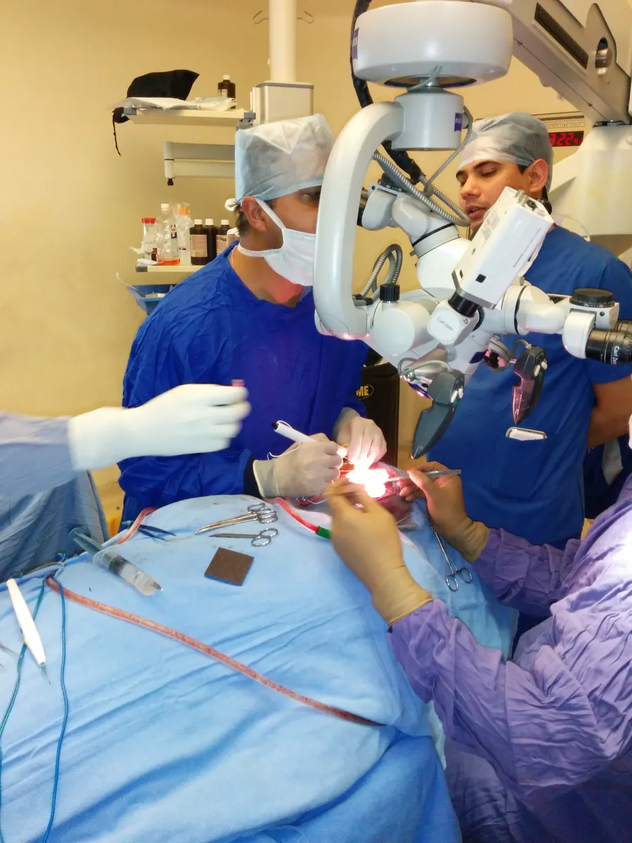Dr Shashidhar operating with a microscope